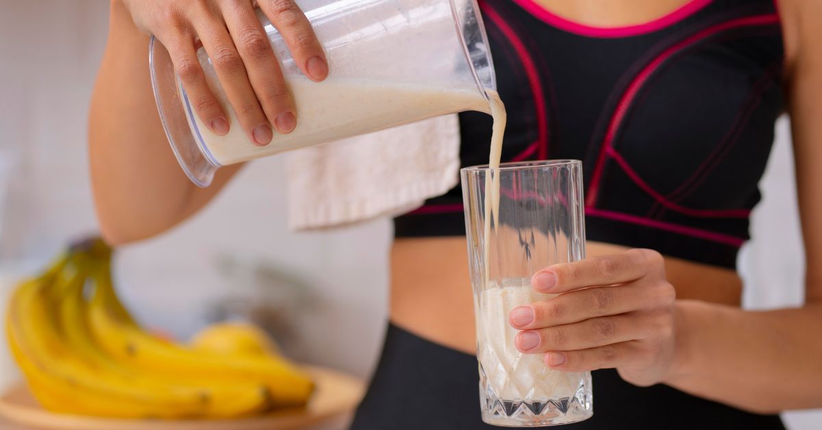 Woman Pouring Protein Shake
