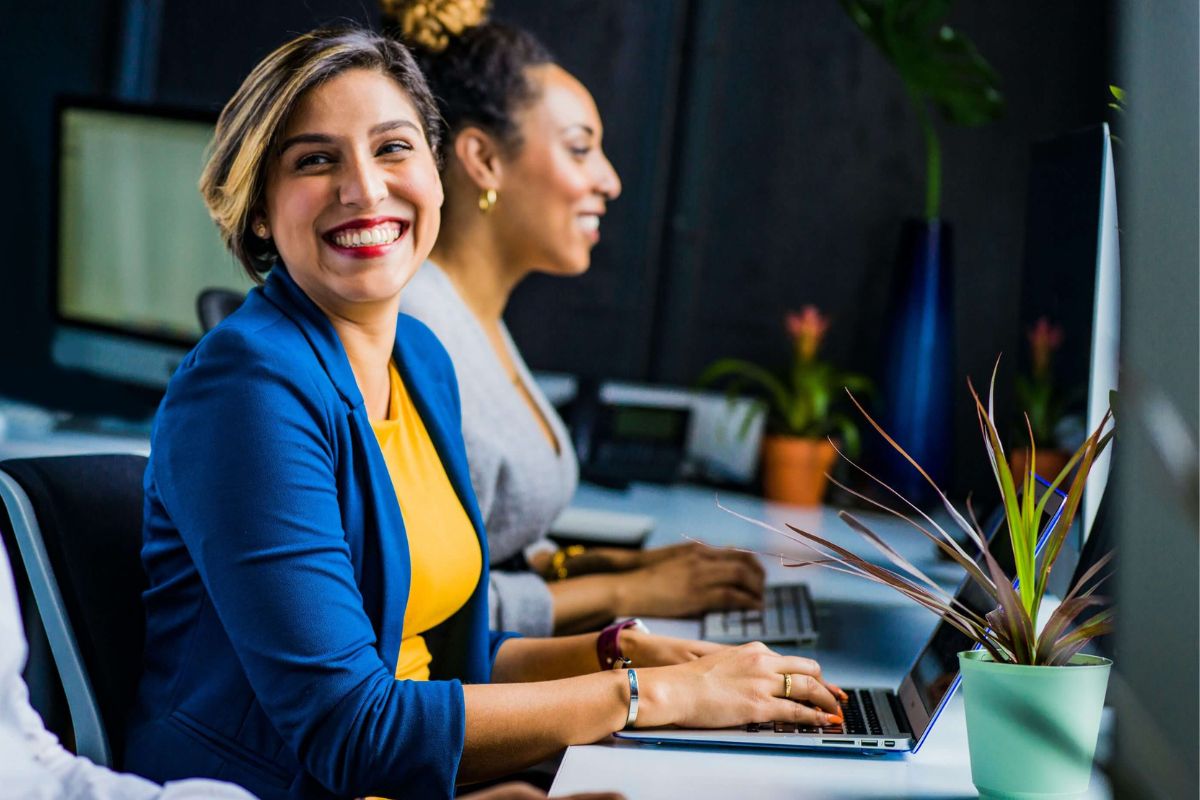 Corporate woman sitting at the desktop